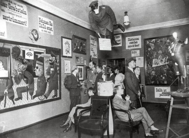 05 Jun 1920 --- Opening of the 1st International Dada fair in the bookshop of the Dr. Burchard in Berlin (Germany). Standing from left to right: Raoul Hausmann, Otto Burchard, Johannes Baader, Wieland and Margarete Herzfelde, George Grosz, John Heartfield. Sitting: Hannah Höch and Otto Schmalhausen. On June 5, 1920. --- Image by © adoc-photos/Corbis